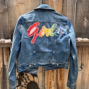 Levi’s blue jean jacket with hand stitched rainbow “girls” patch